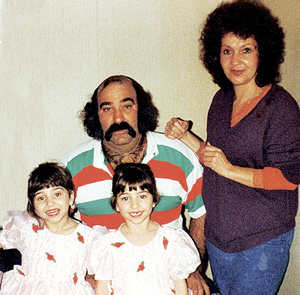  The twins aged four with their parents: After Luigi died they found comfort in becoming more identical