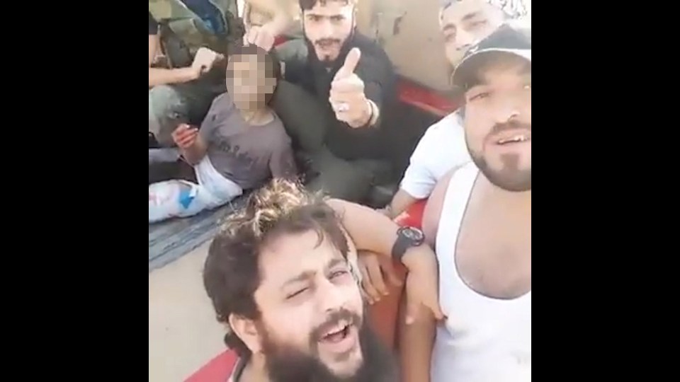  Nour al-Din al-Zenki rebels filmed themselves taunting the young boy in the back of a truck before they brutally executed him