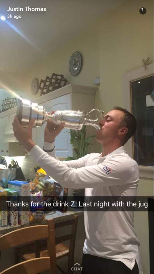  Justin Thomas drinks from the Claret Jug before Zach Johnson gave it back