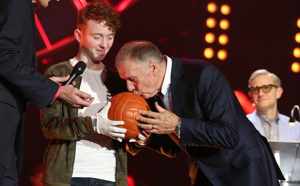 Hatr-trick hero Geoff Hurst kisses the 1966 final ball - held by Louis Ball