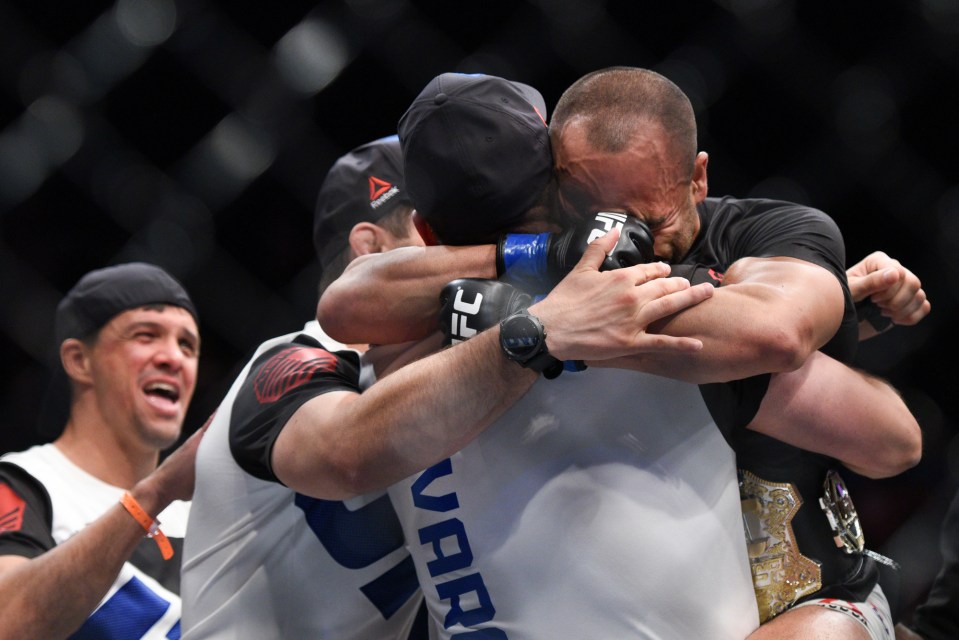  And new! Eddie Alvarez celebrates with his team after his stunning win