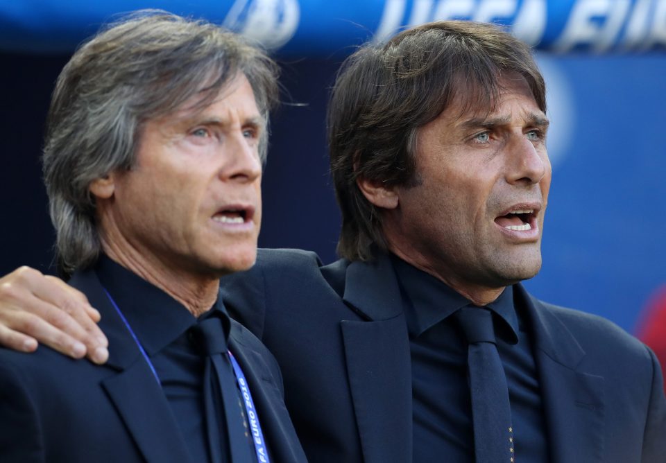  Conte and Gabriele Oriali sing the national anthem before the defeat to Germany