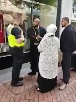  The officer approaches the preacher after a member of the public makes a complaint