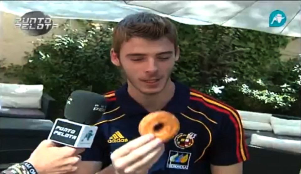  United keeper David De Gea snacks on a doughnut during an interview