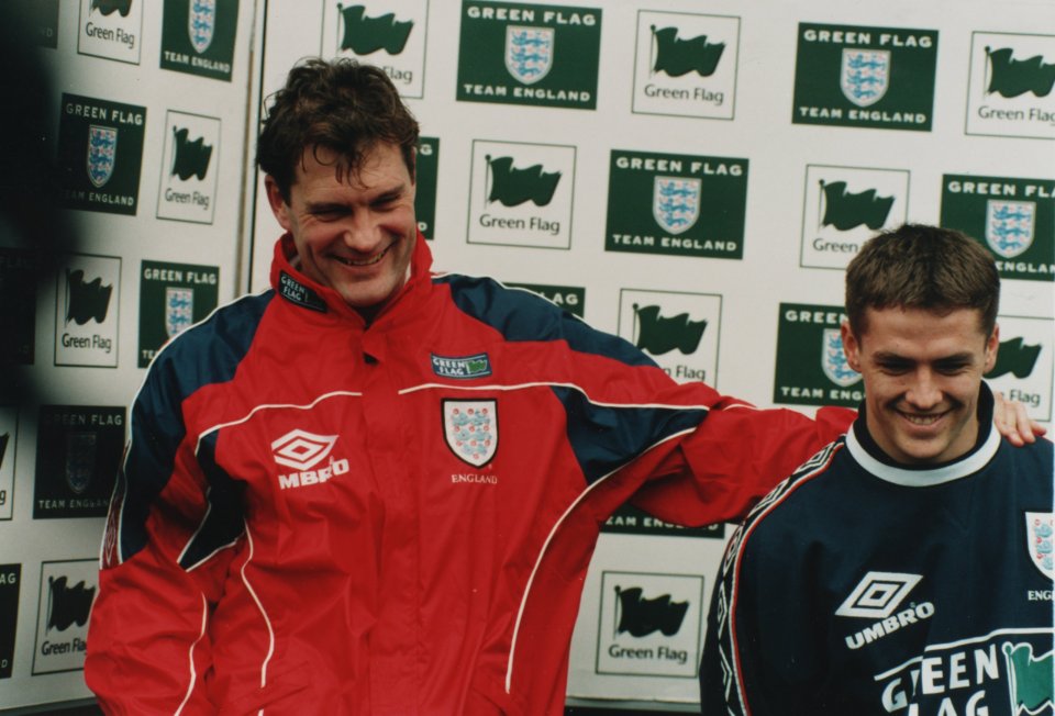 Glenn Hoddle accompanies a young Michael Owen during his time as England boss in 1998