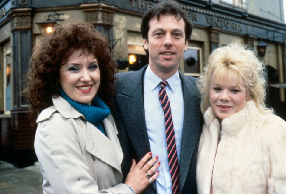  Leslie as Dirty Den pictured with his on-screen wife Angie and adopted daughter Sharon back in the 80s