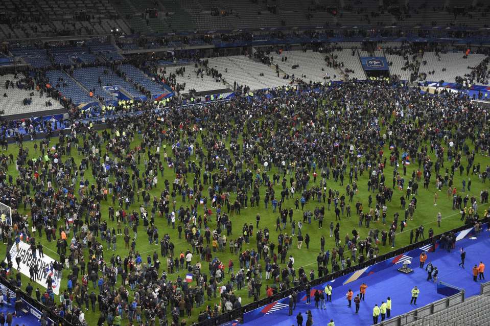  Panic ... Spectators gather on the pitch on the night of the 13 November Paris attacks