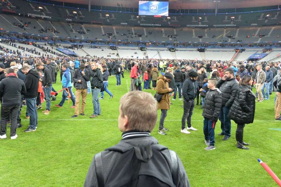 Spectators wait on the pitch of the Stade de France in November 