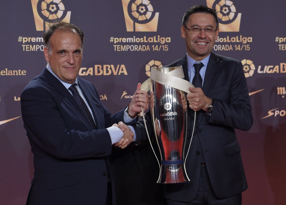 FC Barcelona's president Josep Maria Bartomeu (R) is handovered by LFP's (Spanish Professional League) president Javier Tebas