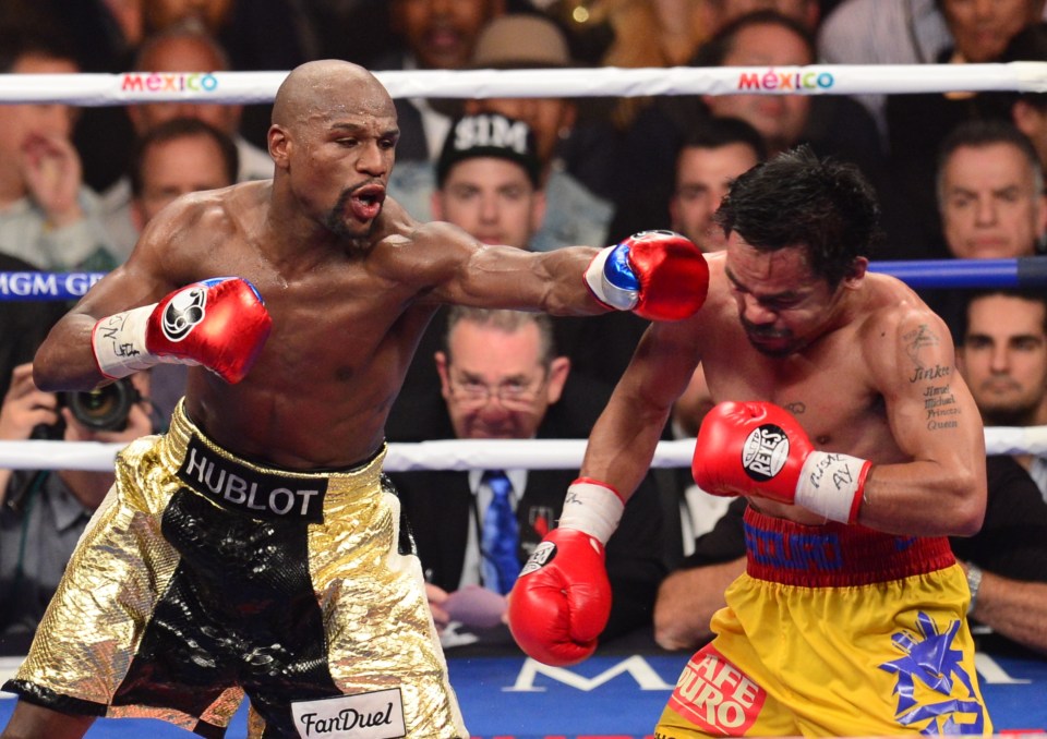  Floyd Mayweather lands one on Manny Pacquiao in the 'Fight of the Century'