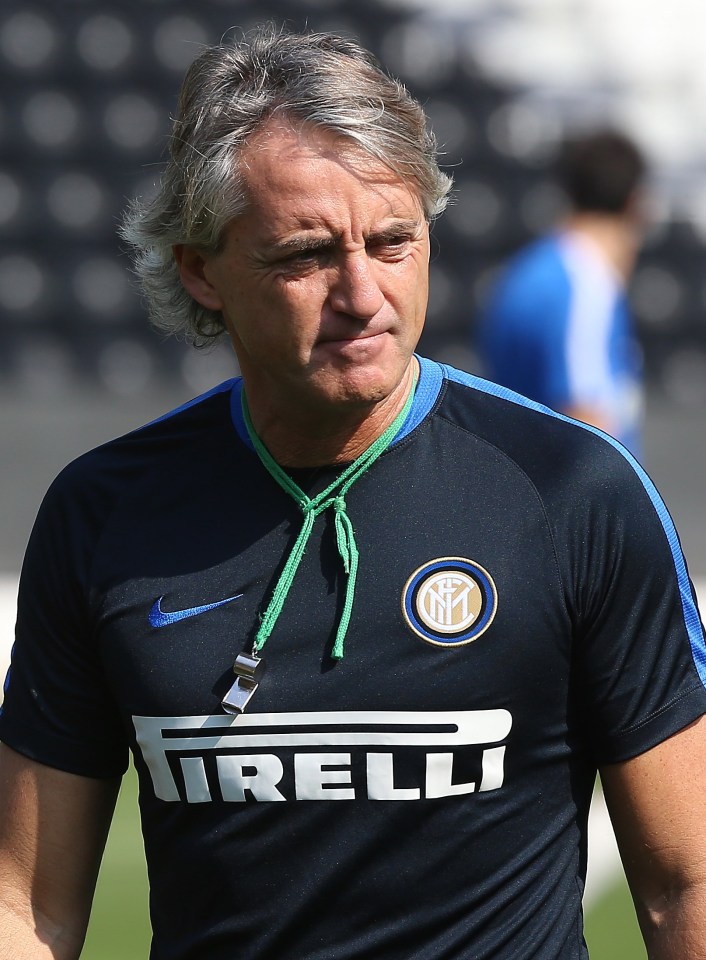 Inter Milan football club's head coach Roberto Mancini attends a training session during team's winter training camp in the Qatari capital Doha on December 29, 2015, one day ahead of their friendly match with Paris Saint Germain. AFP PHOTO / KARIM JAAFARKARIM JAAFAR/AFP/Getty Images