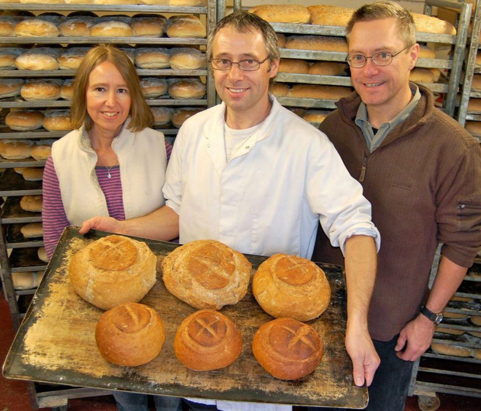 Sally and John, seen either side of a baker, 