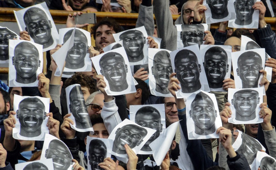 Napoli supporters hold up prints of Koulibaly after he was racially abused against Lazio