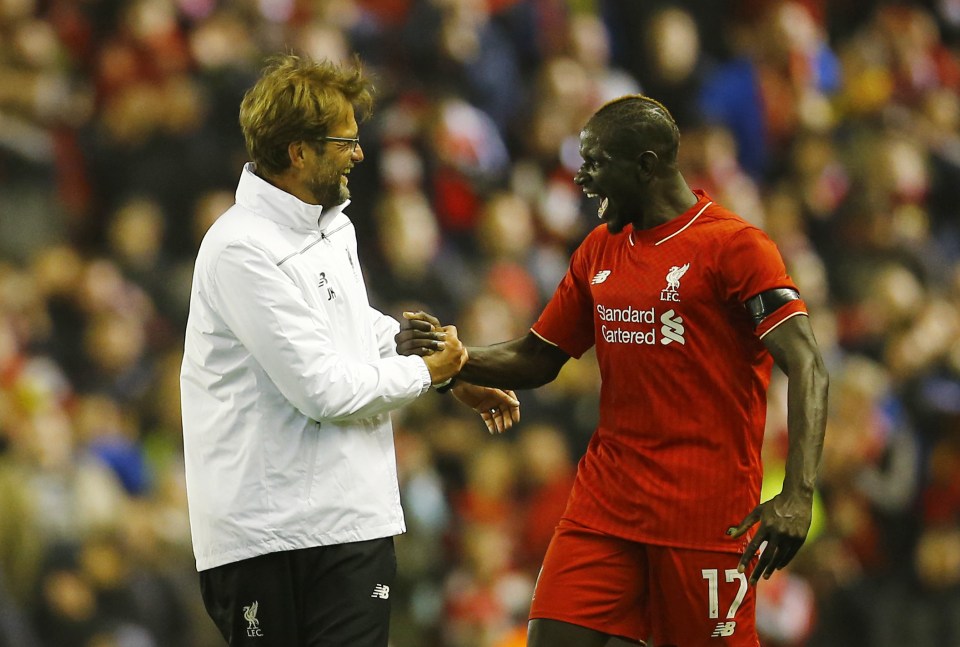  Sakho celebrates with boss Klopp after beating Dortmund in the Europa League