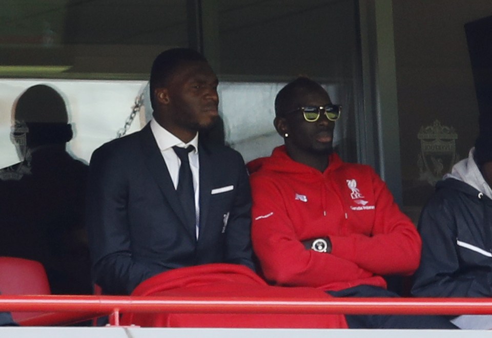 The defender watches Reds v Newcastle from the stands due to his ban last season