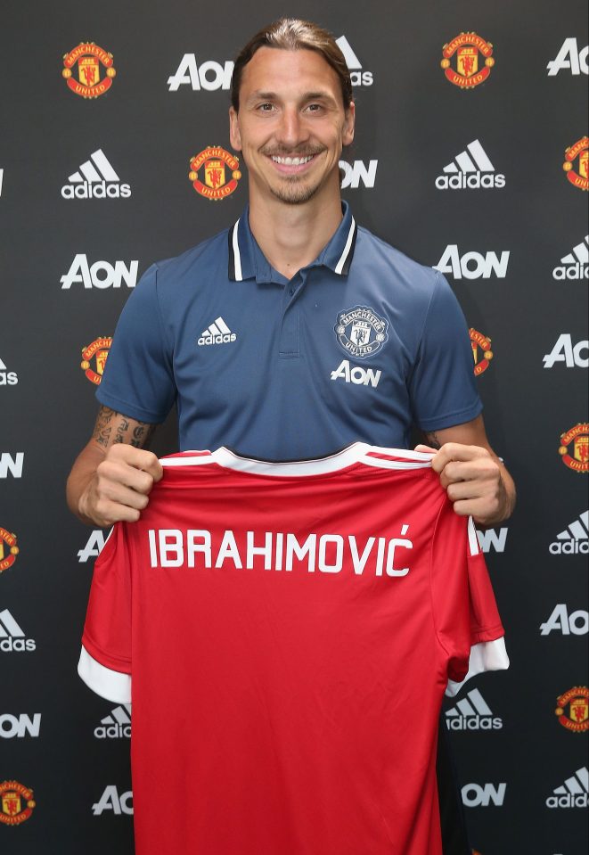  Zlatan Ibrahimovic poses with United shirt after completing move from PSG