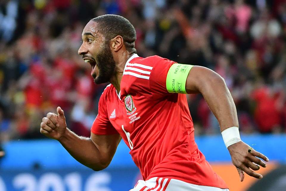  Ashley Williams sprints towards the Wales bench after scoring for the Red Dragons in Lille