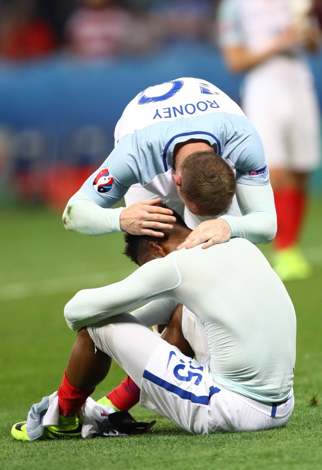  Wayne Rooney consoles Daniel Sturridge after England were knocked out of Euros