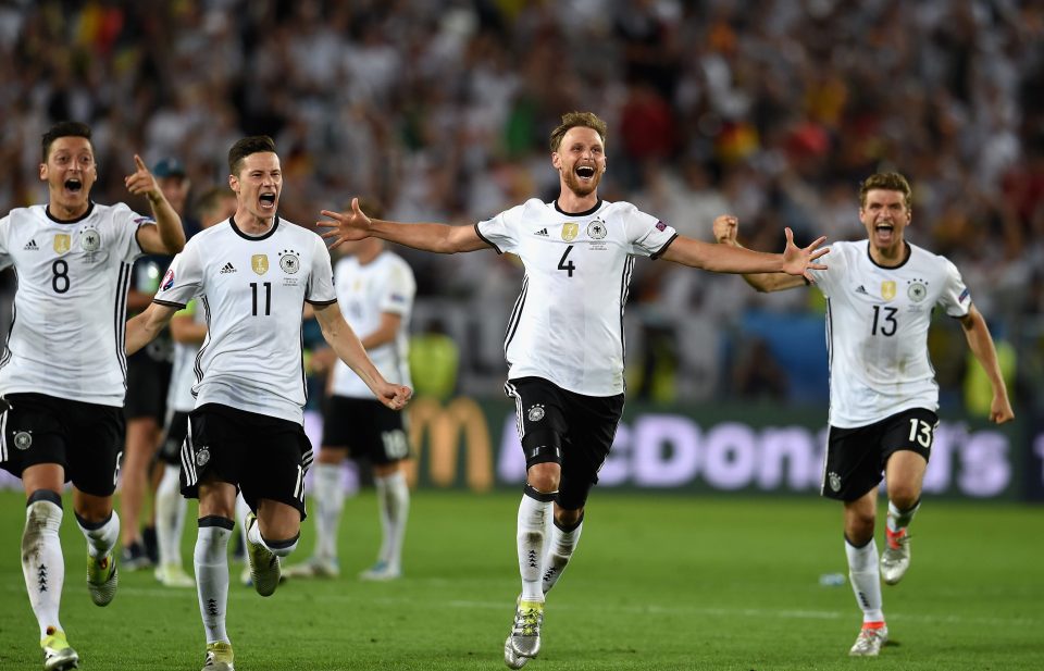  Germany celebrate after Jonas Hector's penalty sent them to Euro 2016 semi-finals