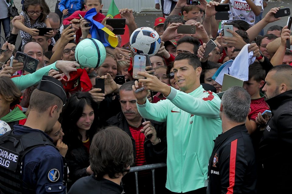  Cristiano Ronaldo poses for selfies with fans ahead of semi-final against Wales