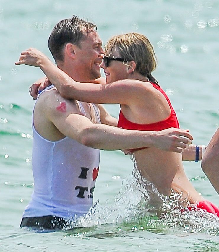  Tom Hiddleston and Taylor Swift cavort in the sea during whirlwind romance