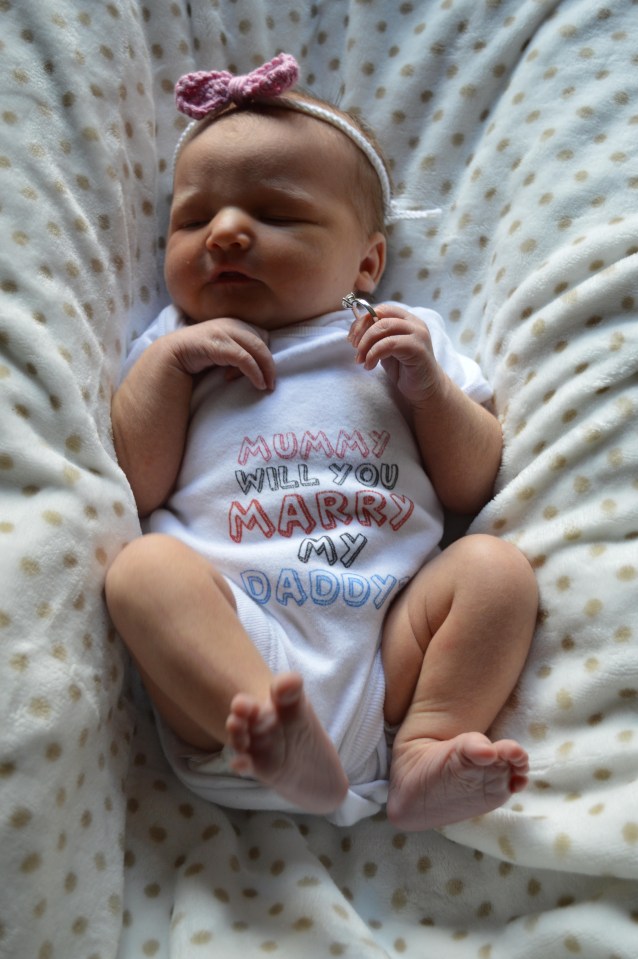 Beau-Bell Dale wearing the proposal babygro