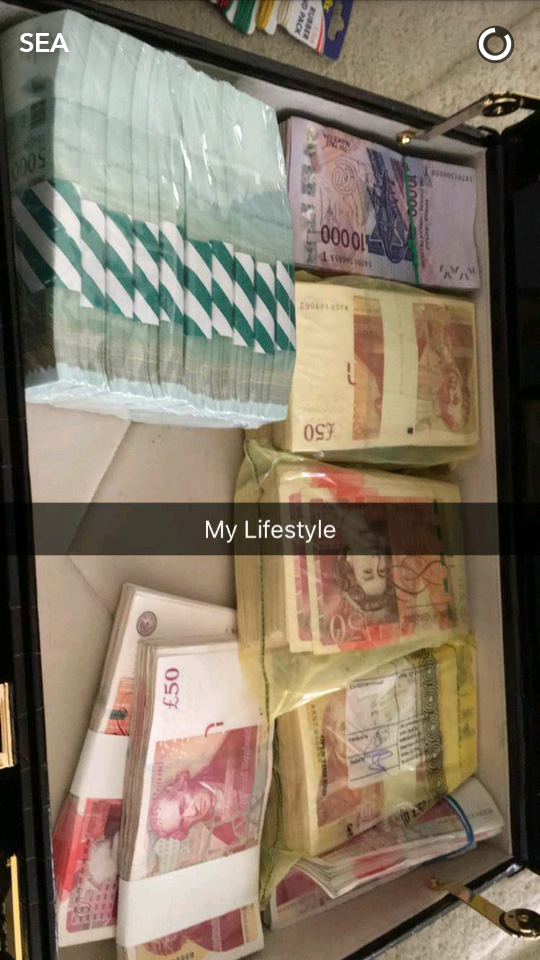  Emmanuel Adebayor showed off piles of cash inside a briefcase