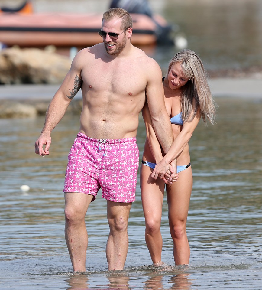  Chloe keeps her man close to her as they make their way through the sea