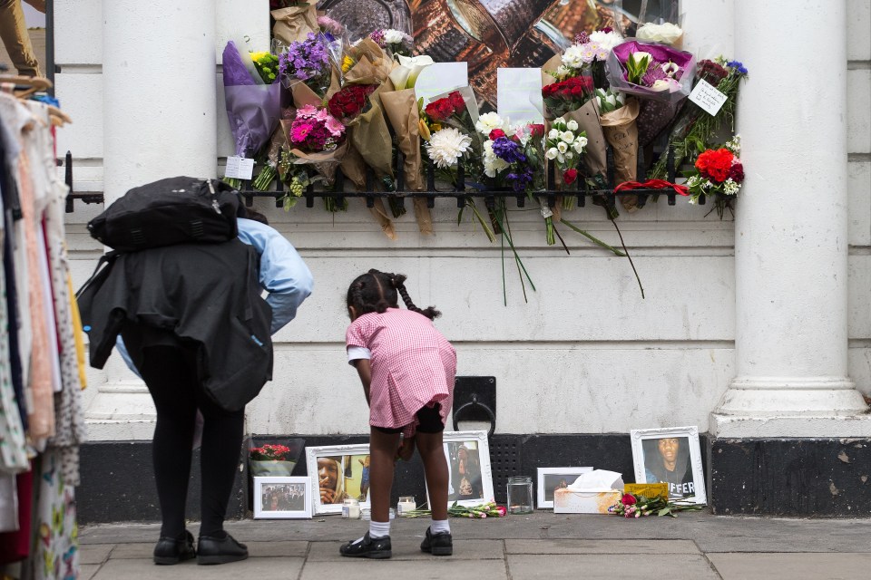  Passersby read tributes to the much-loved teen