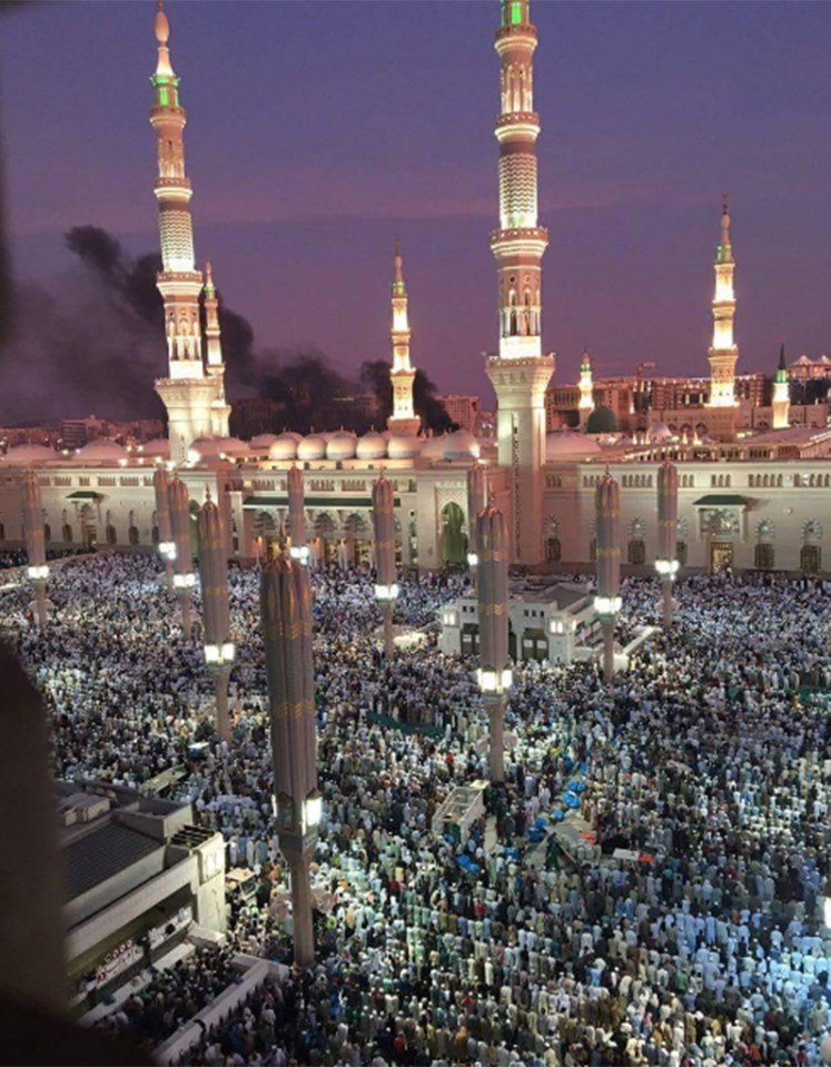  Panic ... The cloud of smoke shows how close the attack got to the throngs of worshippers