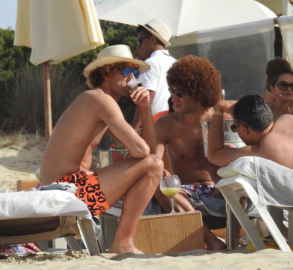  Fellaini puffs on his cigar