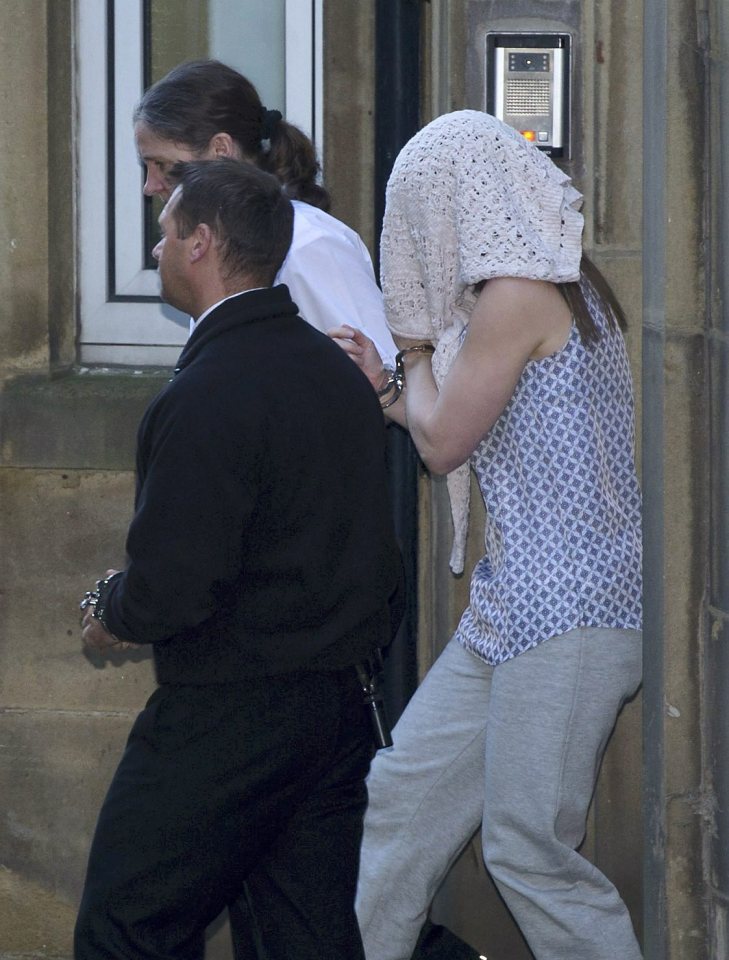  Sarah Williams is led away from an earlier court hearing where she stands accused of the brutal, pre-planned murder