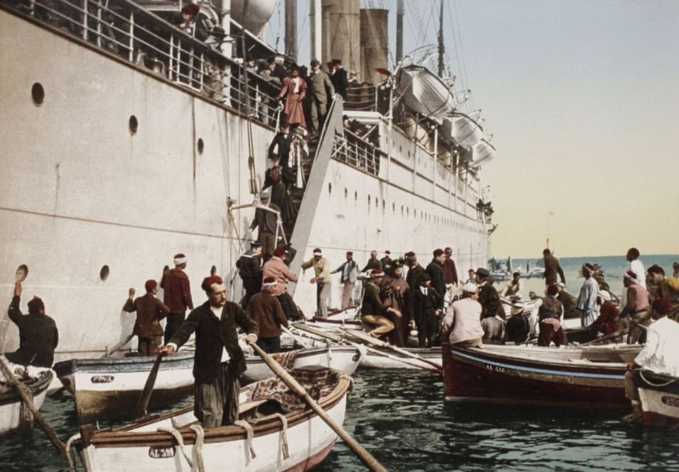 This busy scene shows workers meeting a cruise ship in Algiers, Algeria, in 1896 