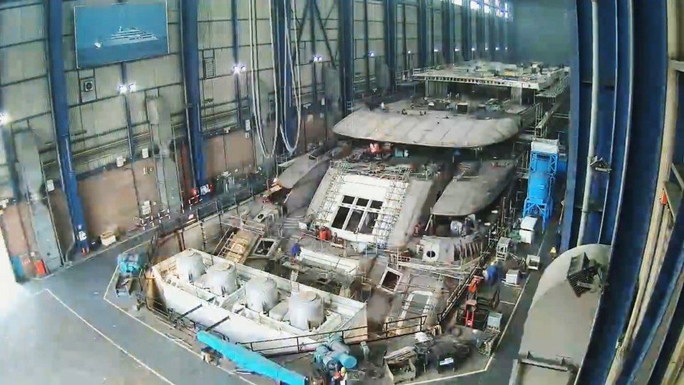 A video shows the construction of the yacht, which features two helipads and a massive pool