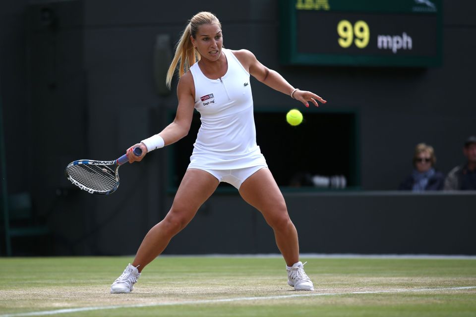 Dominika Cibulkova returns a forehand to her rival