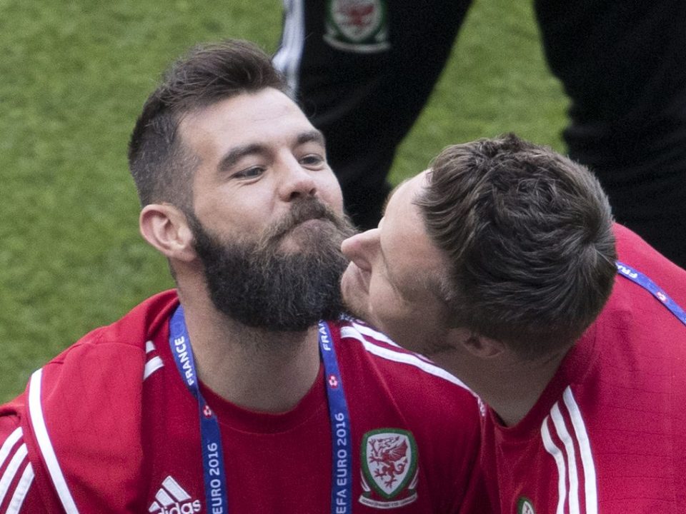  The goalkeeper and midfielder rub facial hair