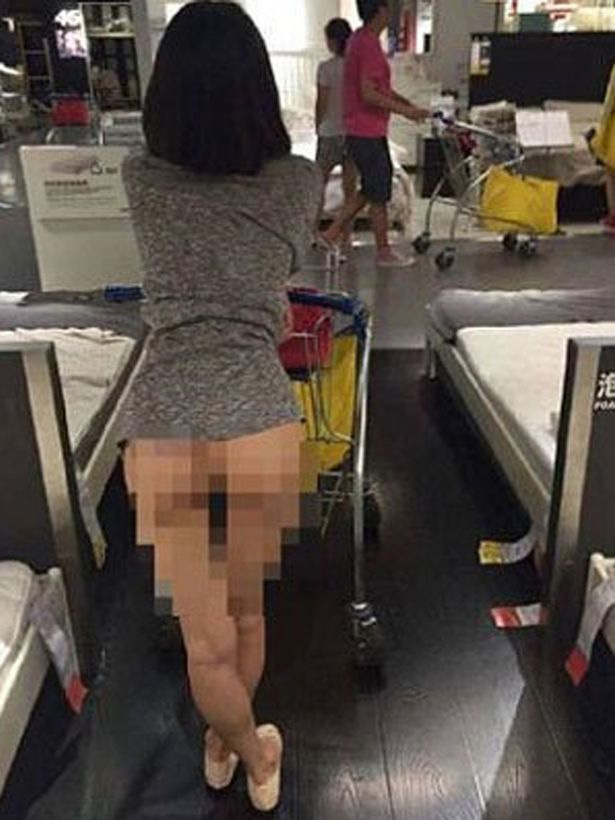  She is seen leaning provocatively on her trolley as she peruses the store