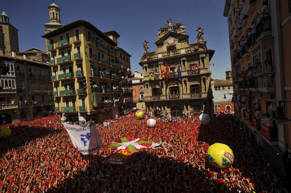  Seeing red: The city's main square is overflowing with people drenching each other in wine for the start of the nine-day fiesta