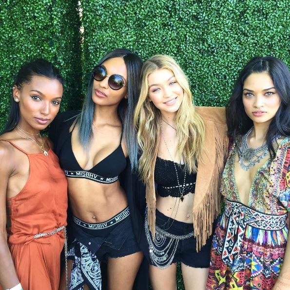  Showing off her toned tum with Gigi Hadid at Coachella