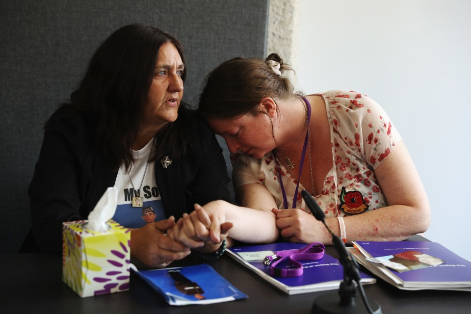  Relatives of soldiers who died in the Iraq War comfort each other at the launch of the Chilcot Inquiry report