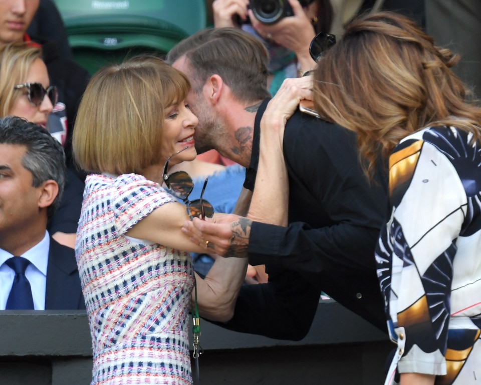  David Beckham embraces Vogue chief Anna Wintour at Centre Court