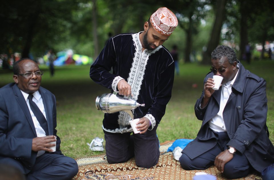  A group of men drink tea to celebrate the end of Ramadan and their fasting