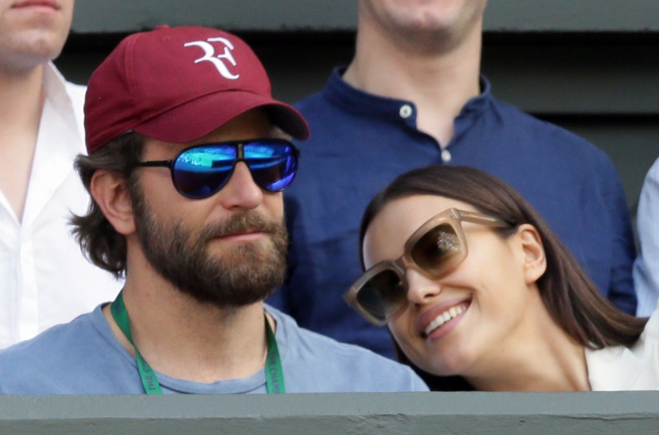  The dark-haired beauty gazed lovingly at her beau as he watched the action on the tennis court