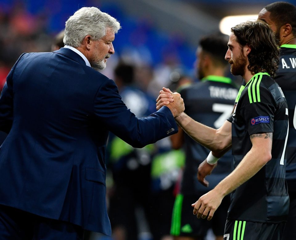 Hughes greets Joe Allen after Wales had lost their Euro 2016 semi-final to Portugal earlier this month