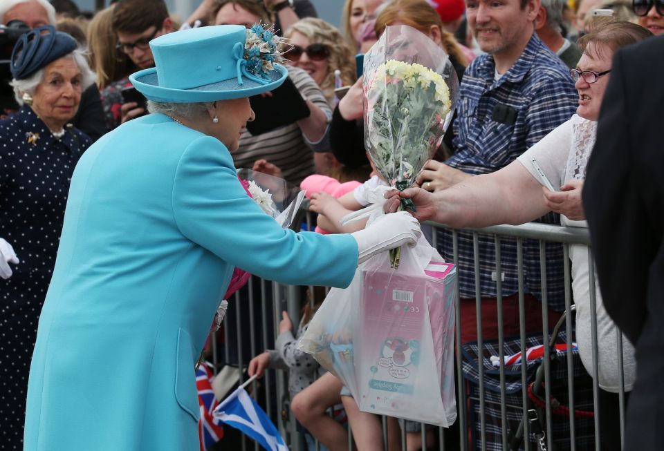  Although on second glance the Queen looked delighted with the present, which appeared to be a child's doll along with a toy from hit kids' movie Toy Story