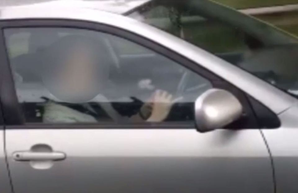  Puzzling ... shameless driver kept playing with Rubik's Cube even after she was spotted