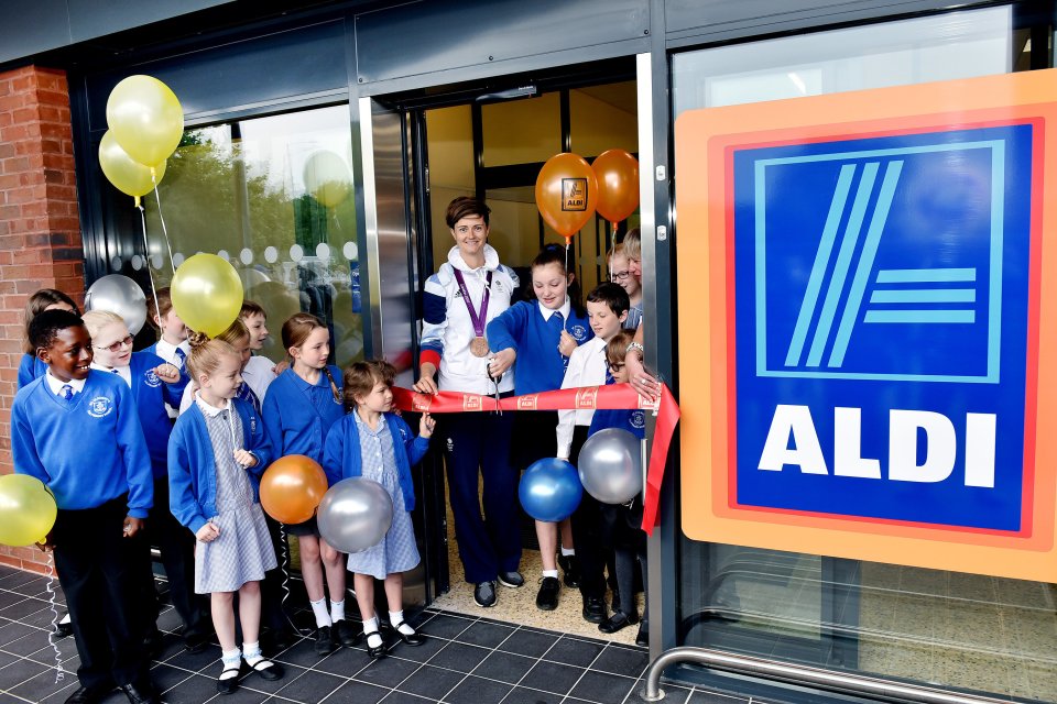  Schoolchildren and GB hockey star Sally Walton cut the ribbon at the store opening