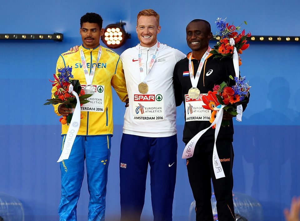  Greg Rutherford on the podium with silver medallist, Michel Torneus , on his right