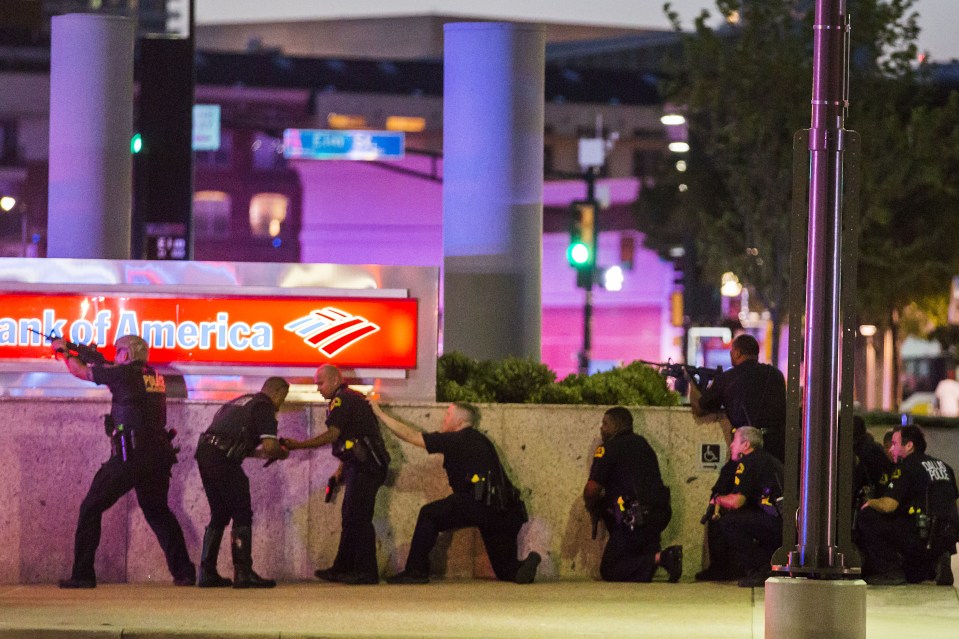  Police ducked to avoid the sniper fire of Johnson on the streets on Dallas on Thursday evening