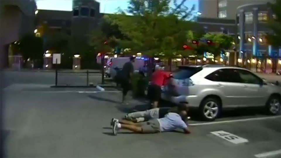  Members of the public duck for cover as the gunmen fire shots